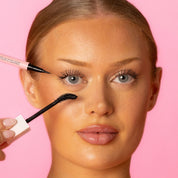 Model applying Lash Therapy Australia black Everylash mascara and growth serum eyeliner
