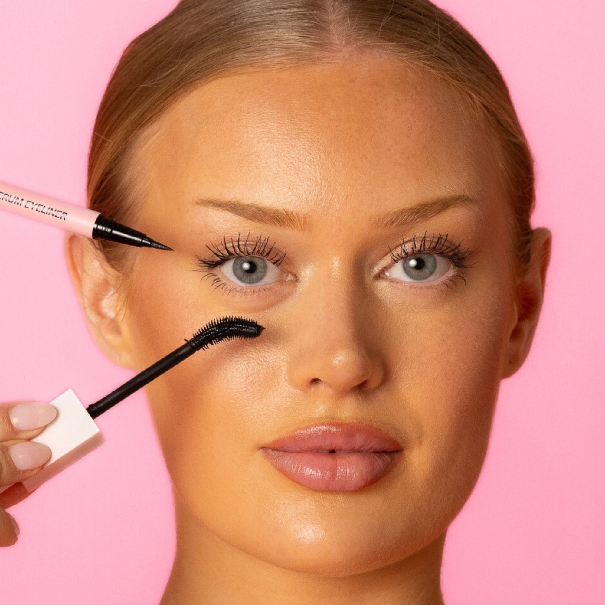 Model applying Lash Therapy Australia black Everylash mascara and growth serum eyeliner