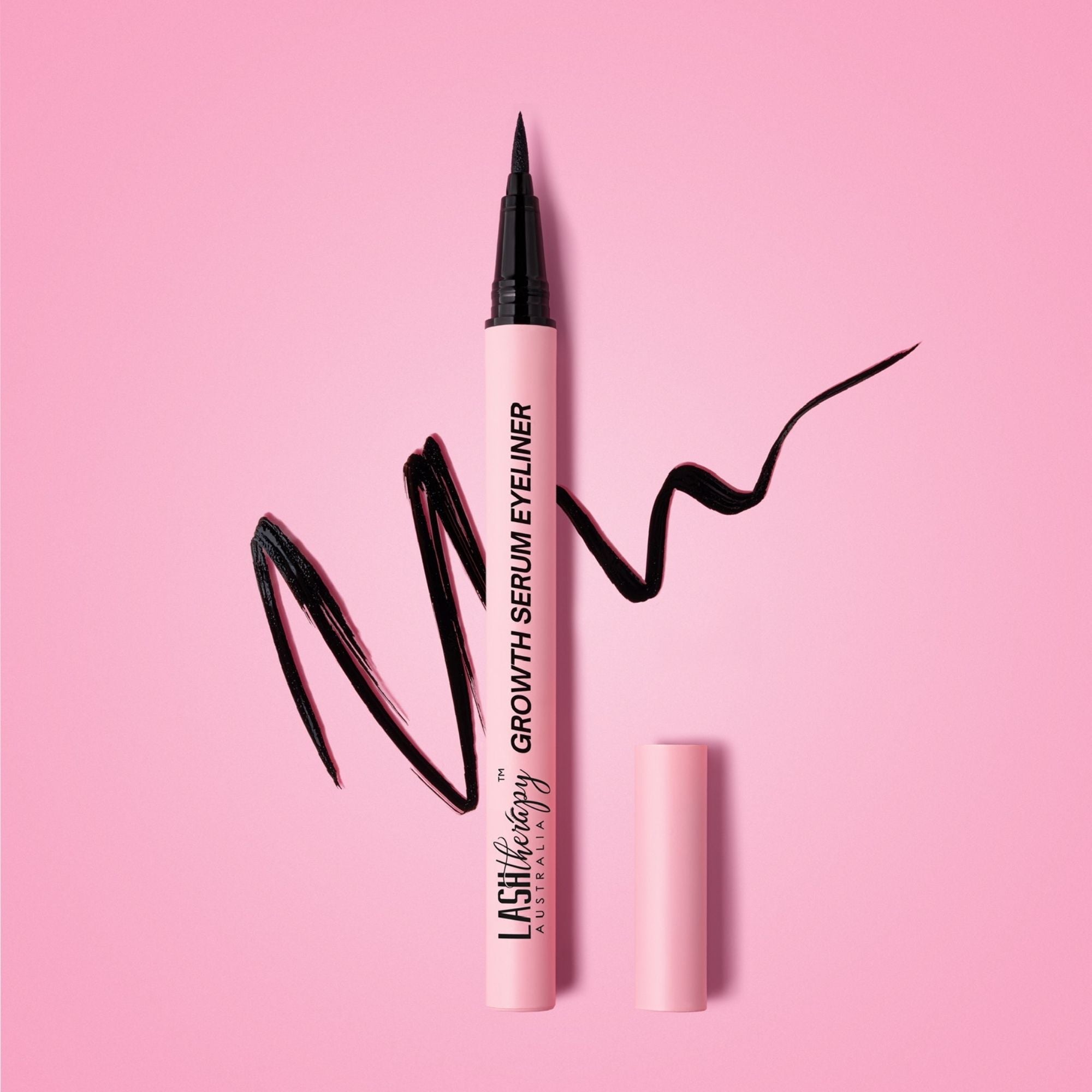 Lash Therapy Australia Growth Serum Eyeliner with precision liquid eyeliner tip on pink background.