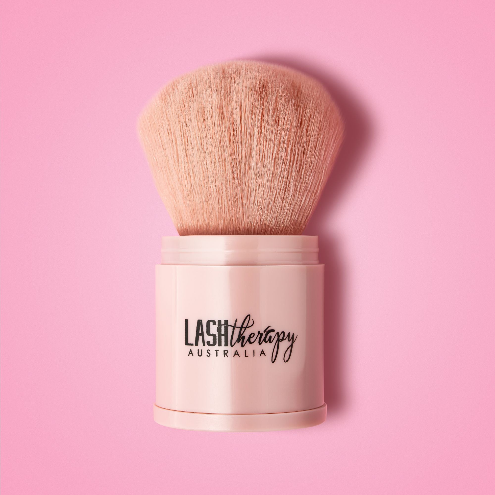 Lash Therapy Australia makeup brush for applying cosmetics on pink background