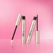 Lash Therapy Australia eyelash and eyebrow growth serums set with precision applicators on pink background.